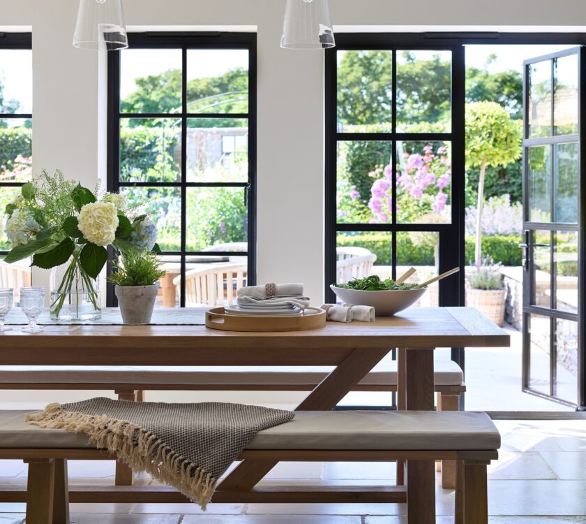 dining room with the best steel look doors and windows dining table in foreground