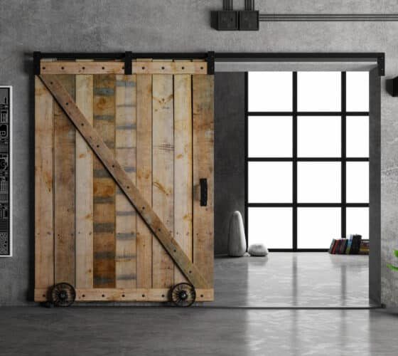 industrial style concept showing a sliding wood door, metal and glass.