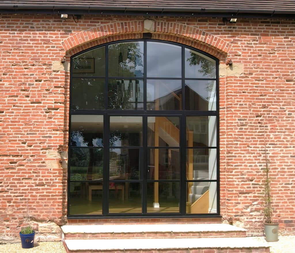 steel look doors in Knowle to a brick barn conversion. 