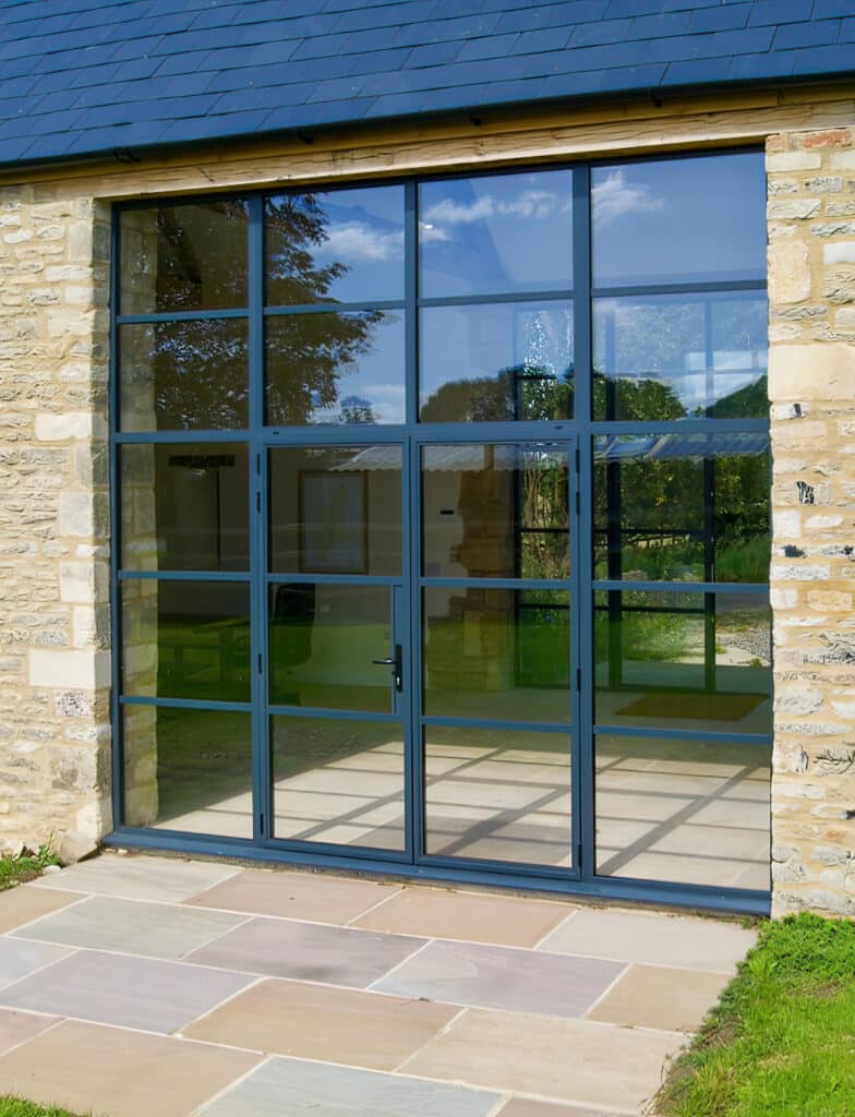 industrial style french doors in a barn conversion