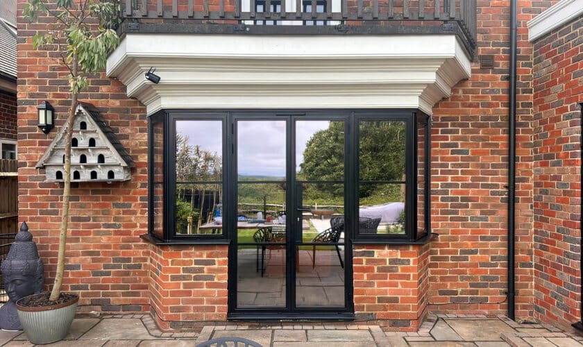 steel look windows in Kent house with patio doors.