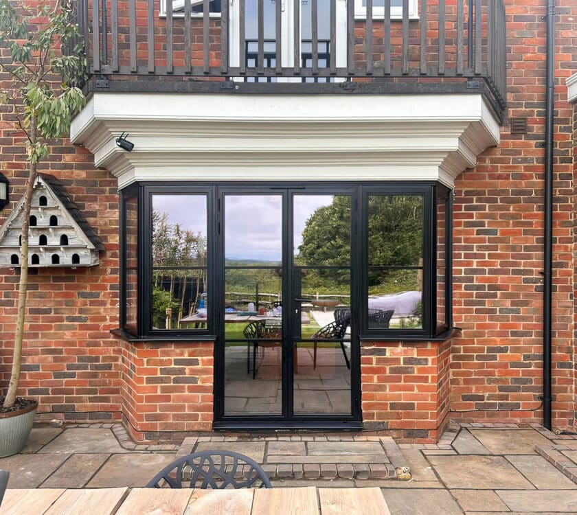steel look windows in Kent house with patio doors.