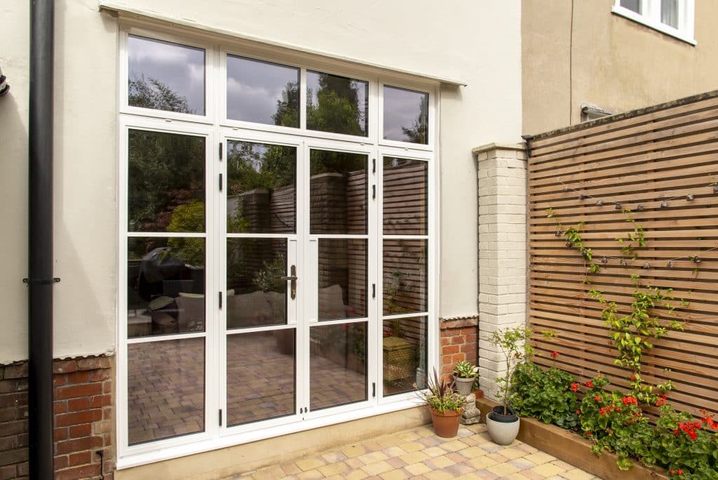 white steel look doors with side panels in a period property