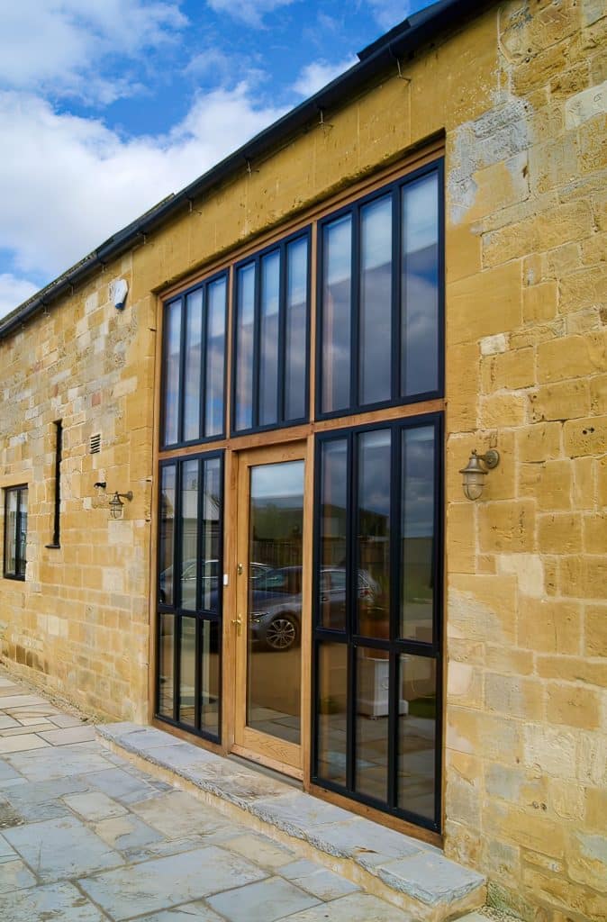 black heritage windows in a front entrance screen