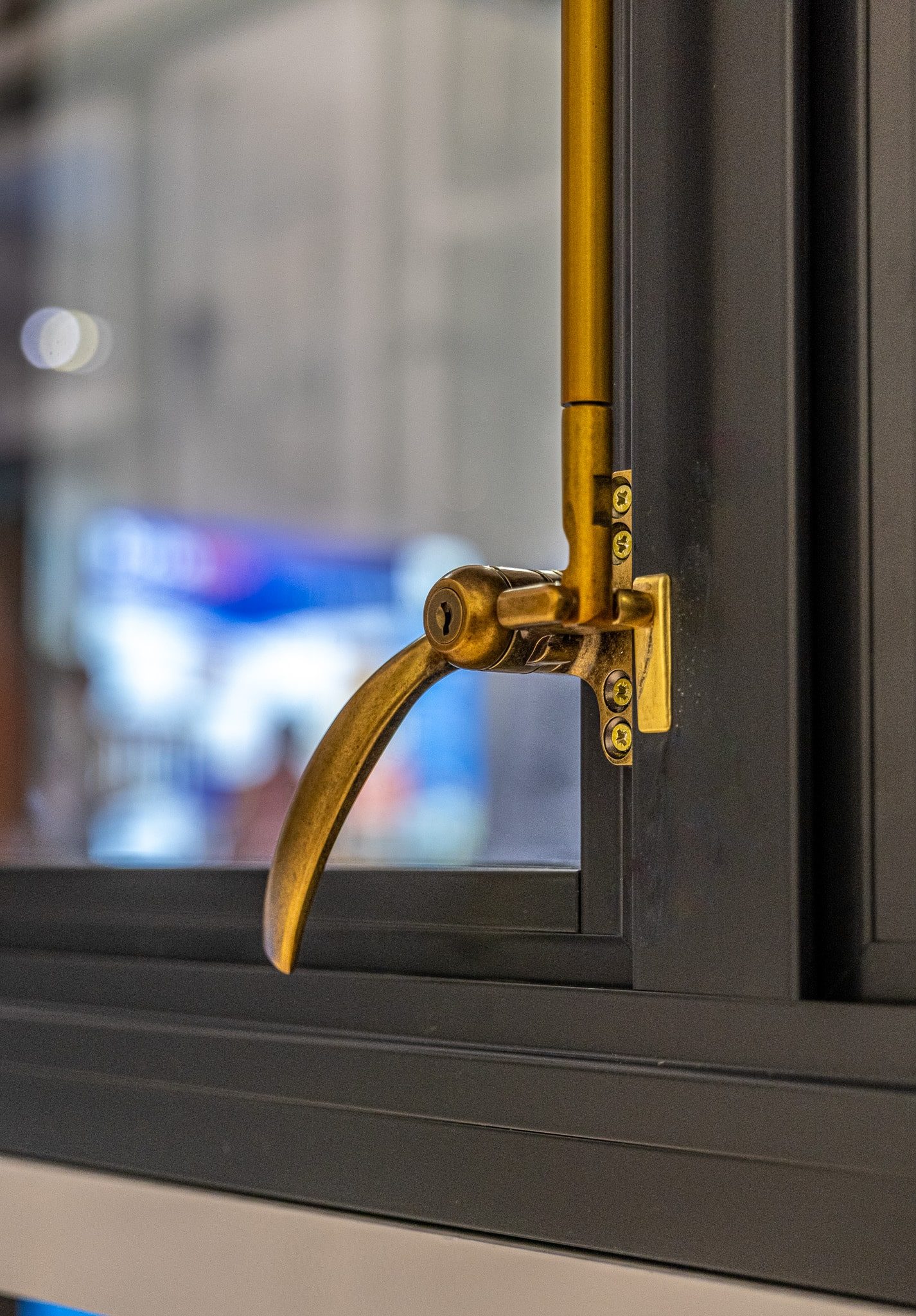 duplex brass lock on an aluco window in the closed position