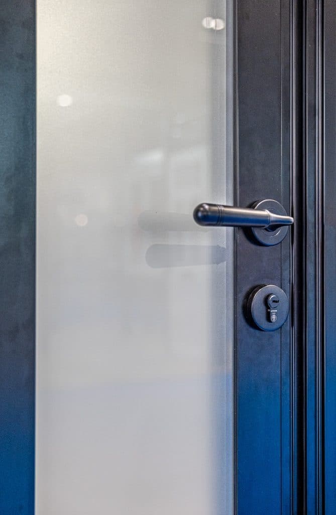 teaser picture of new aluco steel look front door showing close up of handle and glass