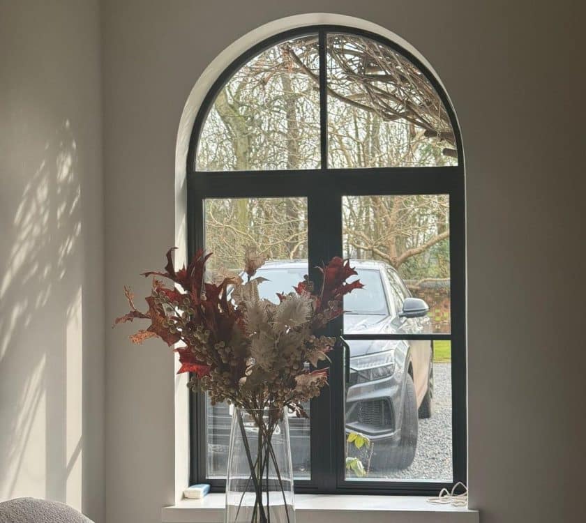 picture of aluco elite window with plant pot in front and curved head