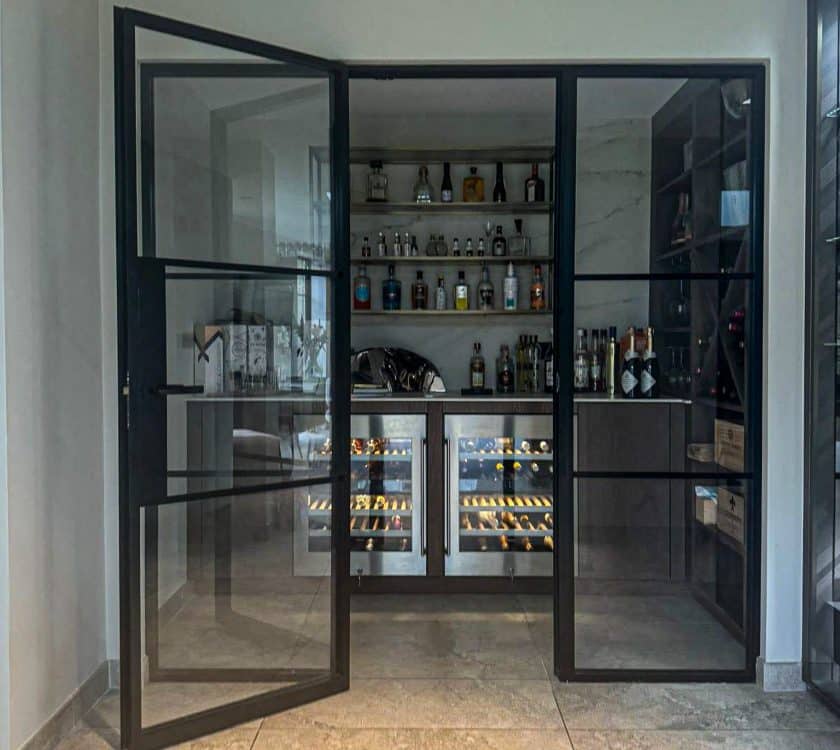 aluco internal doors in front of a bar area in a house