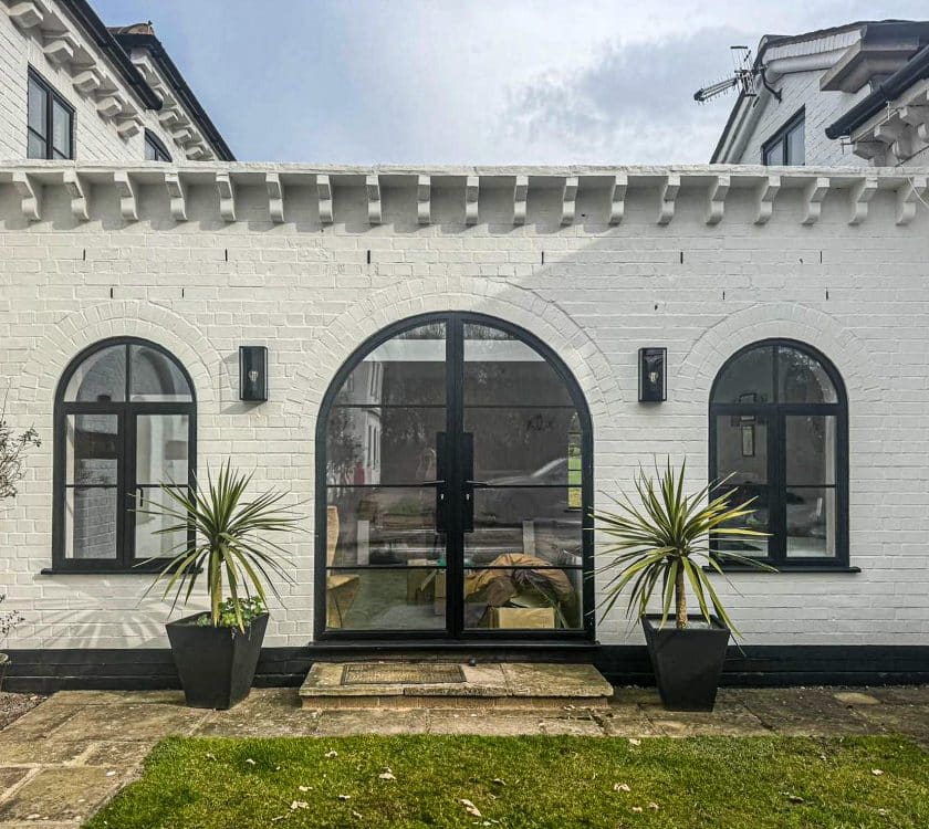 picture of curved aluco windows and doors in a link separating two period rooms