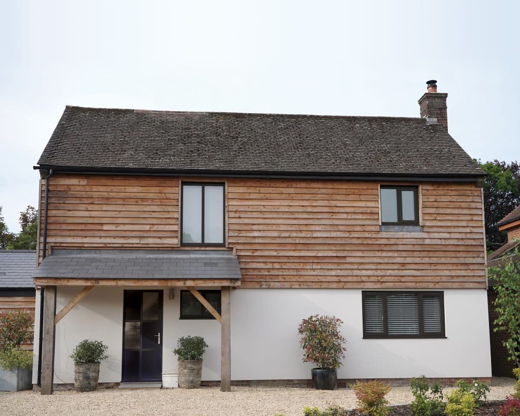 picture of whole house with aluco windows and front door