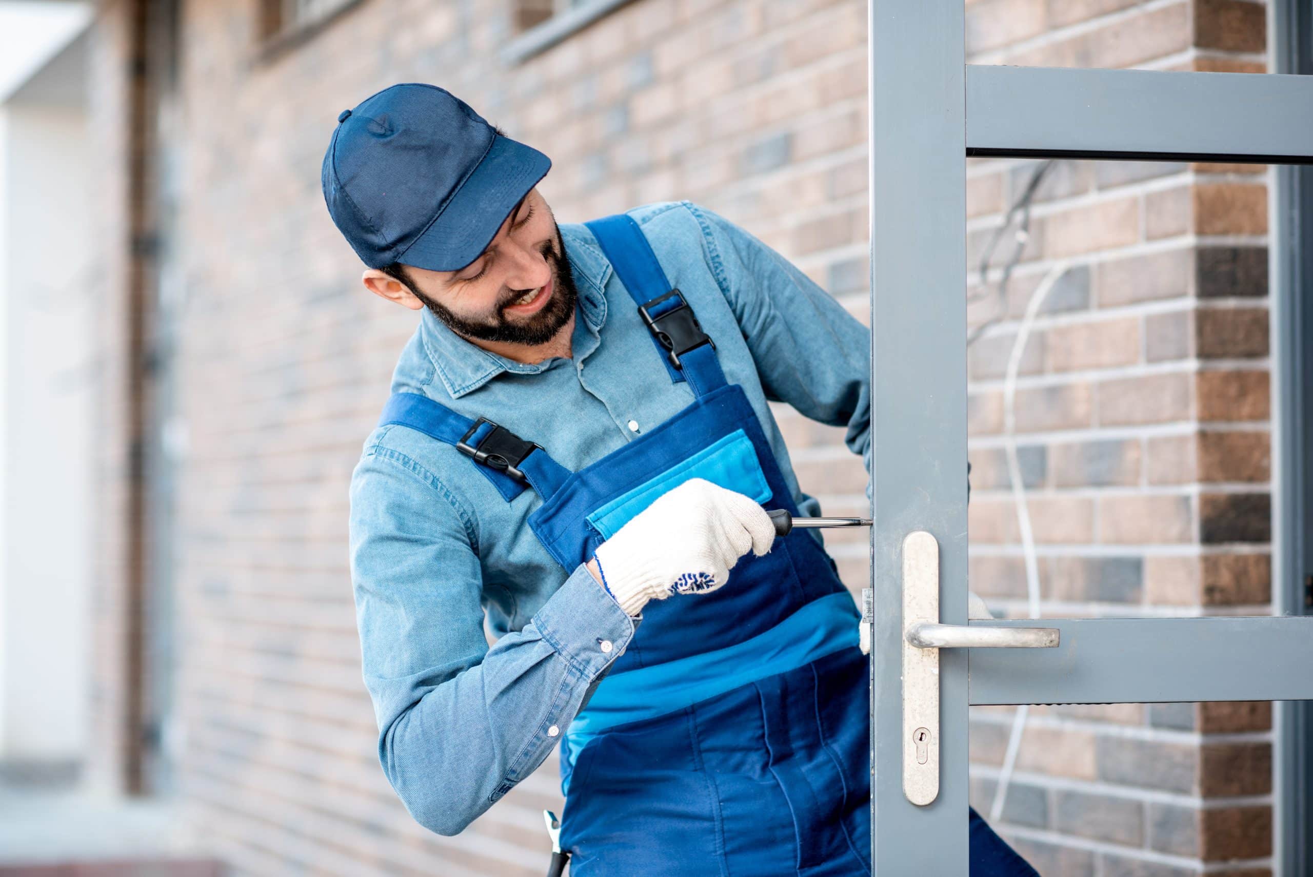 picture of a fitter adjusting a grey door