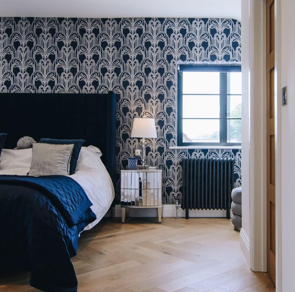 art-deco windows in hampshire to a bedroom with decorative feature wall, wood floors and aluco black window